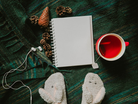 View from the top of the pad, headphones and a cup of teaの写真素材