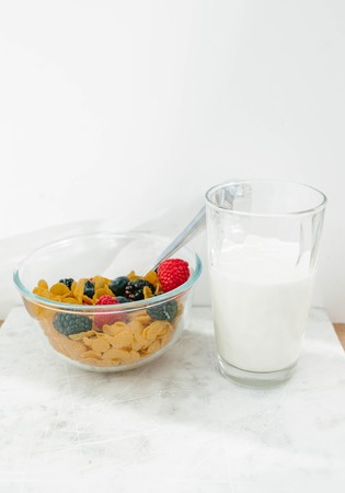 Granola, cereal with berries and a glass of milk, foodの写真素材
