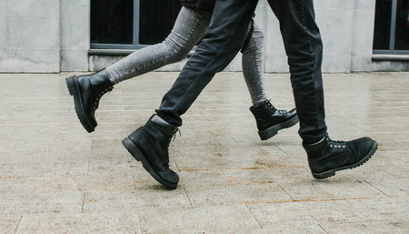 a guy and a girl running romaticの写真素材