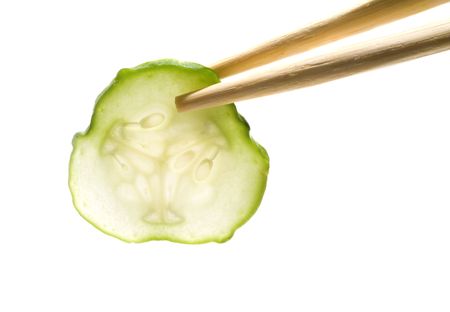 Diet. Slices of vegetables. Isolated on white.の写真素材