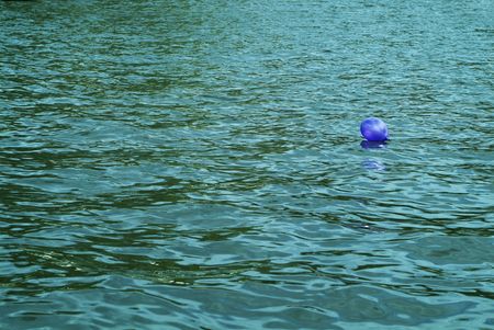 balloon floating on waterの写真素材