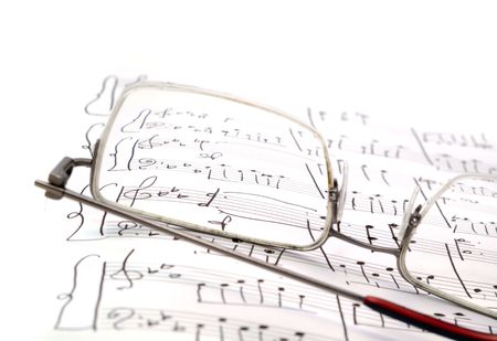 music notes and pen and glassesの写真素材
