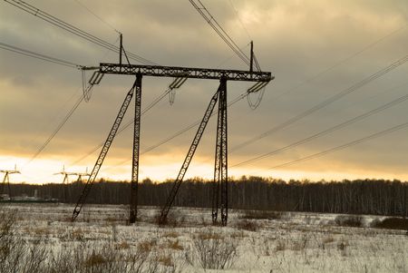 Winter snow landscape with electric linesの写真素材