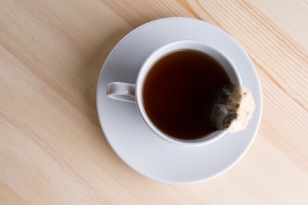 Cup with tea on wooden table.

の写真素材