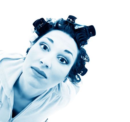 girl in hair curlers. Isolation on the whiteの写真素材