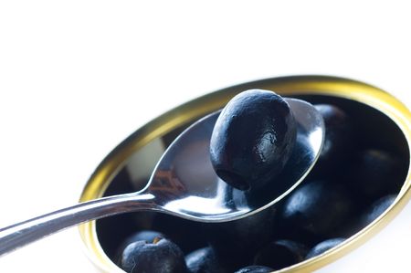 olive  vegetable seed in spoonの写真素材