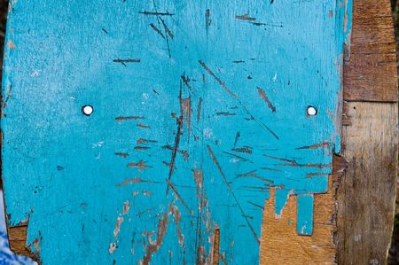 old blue wooden creaked fenceの写真素材