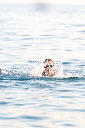 Happy girl swimming in a poolの写真素材