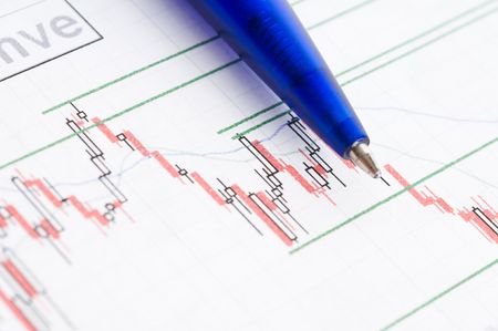 Business accessories on a background of diagrams