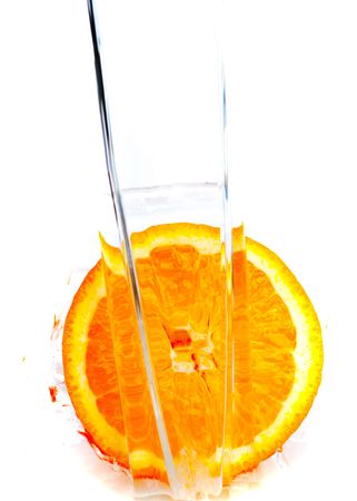 Fresh orange jumping into water with a splashの写真素材