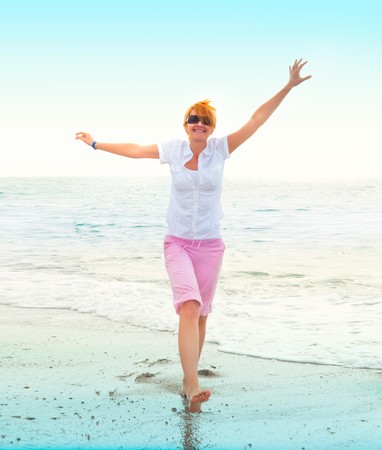 happy young woman on seaの写真素材