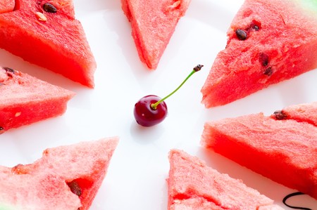 red watermelon over white plateの写真素材