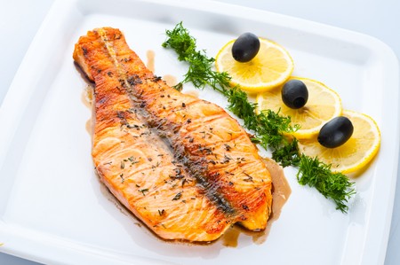 Fish dish - grilled salmon with vegetablesの写真素材
