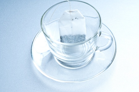 Teabag in the cup with hot waterの写真素材