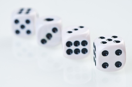 dices falling down against white background.