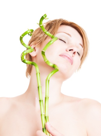 beautiful young woman with bambooの写真素材