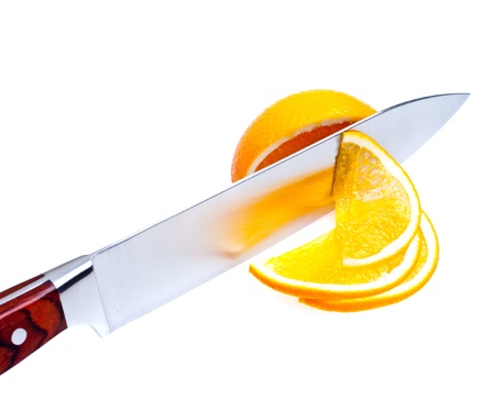 Cutting of fruit by knifeの写真素材