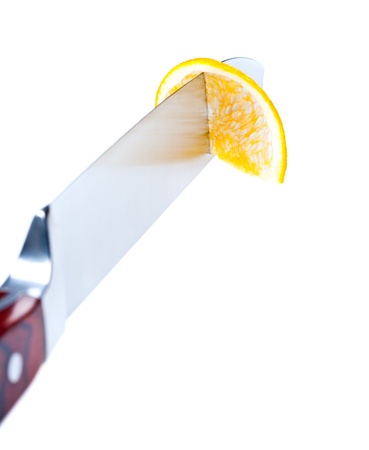 Cutting of fruit by knifeの写真素材