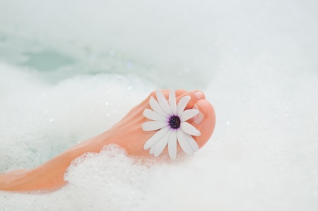 foot with flower and waterの写真素材