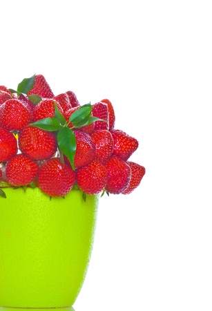 Bouquet from strawberry berries in a green vaseの写真素材