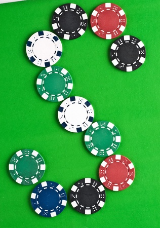 Counters for game in a casino on green a backgroundの写真素材
