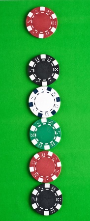 Counters for game in a casino on green a backgroundの写真素材