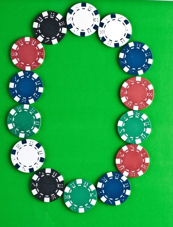 Counters for game in a casino on green a backgroundの写真素材