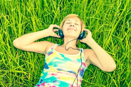 young woman with headphonesの写真素材
