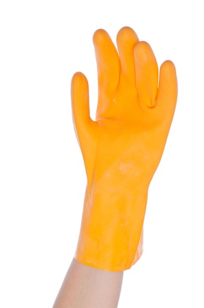 Gloved hand holding a kitchen sponge isolated on a white background の写真素材