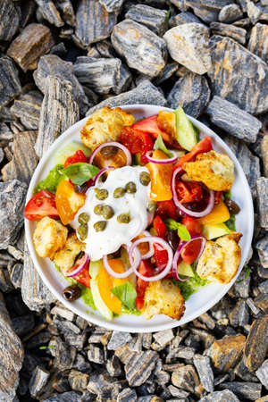 Salad with fresh vegetables and croutonsの写真素材