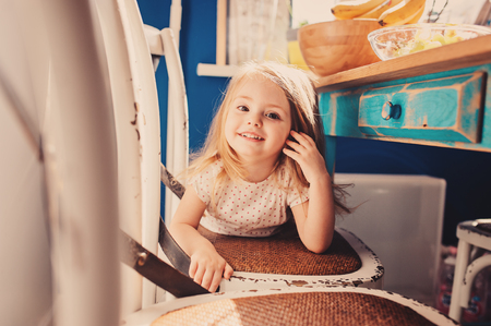 cute toddler girl playing in kitchen, real life lifestyleの写真素材