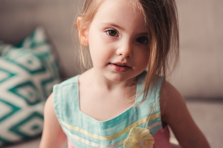 cute toddler girl relaxing at home