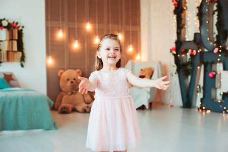 portrait of cute smiling 5 years old child girl celebrating birthdayの写真素材