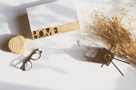 minimalist home aesthetics. Fragrance diffuser, dried flowers and glasses on white background. Comfy living conceptの写真素材