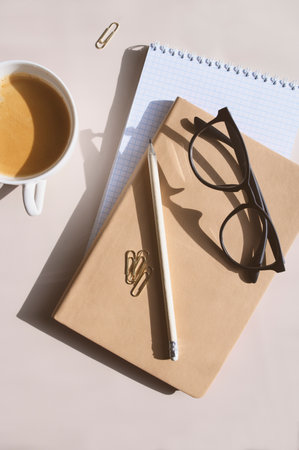aesthetic minimalist workspace. Home office, blog, social media concept. Note book, coffee and...