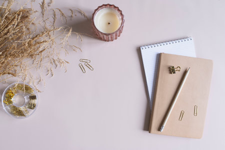 aesthetic minimalist workspace. Home office, blog, social media concept. Note book< dried flowers and office toolsの写真素材