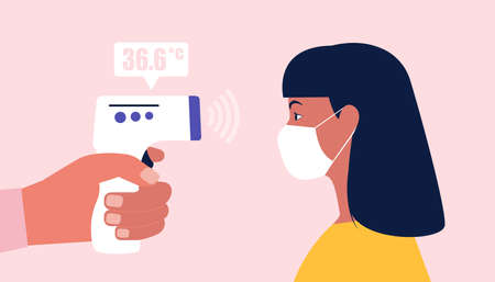 Digital non-contact infrared thermometer measures the temperature of a young woman wearing a medical mask. Vector illustration in a flat styleのイラスト素材