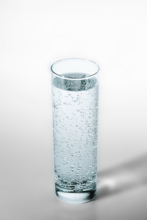 glass of soda water with bubblesの写真素材