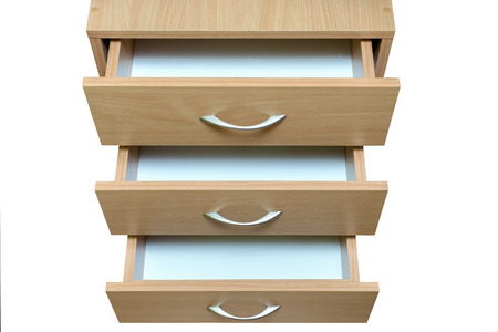 three open drawers with metal handles wood facade isolateの写真素材