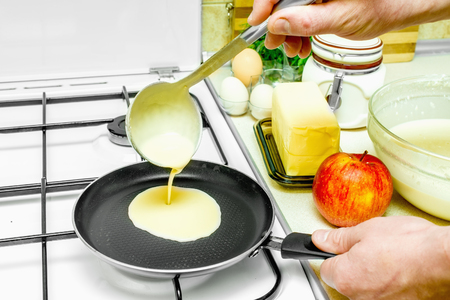 in the kitchen cooking pancakes batter ingredientsの写真素材