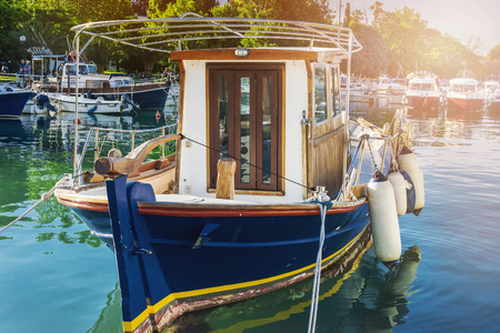 wooden boat at the pier in Budva summer vacationの写真素材