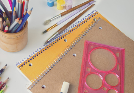 notebooks and pencils, paint, ruler, Eraser, brush, white background