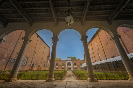 Italian courtyard inside, columns, arches, lawn, antique hanging lampの写真素材