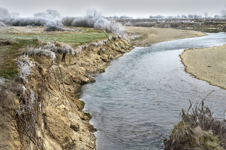 steep riverbank nature autumn freezing riverの写真素材