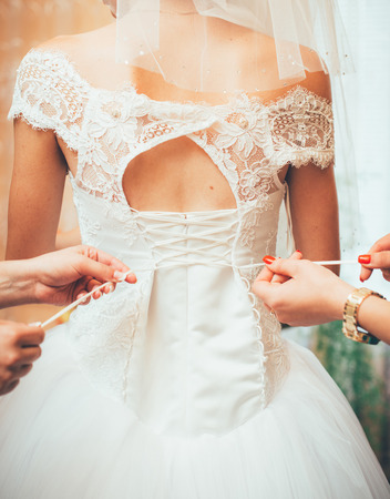 bride dressed in wedding dress, close-up, back, wedding, bride, bridesmaid dressesの写真素材