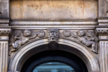 Fragment with mascaron of building`s facade