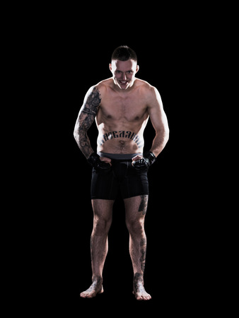 Young MMA fighter fists up ready to fight isolatedの写真素材