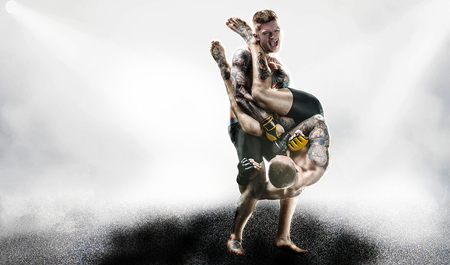 MMA fighters in lights backgroundの写真素材