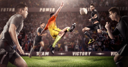 Brutal Soccer action on 3d sport arena. mature players with ball in black and orange uniformの写真素材
