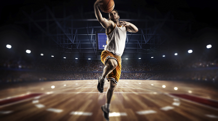one basketball player jump in stadium panorama viewの写真素材